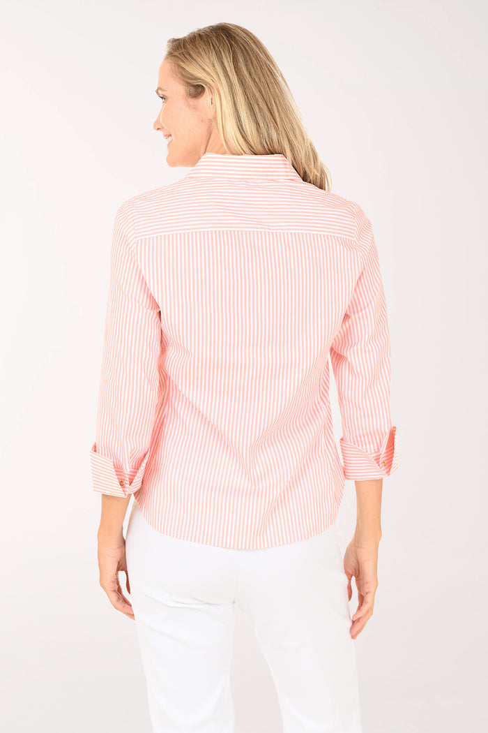 Woman wearing a pink striped shirt on a white background
