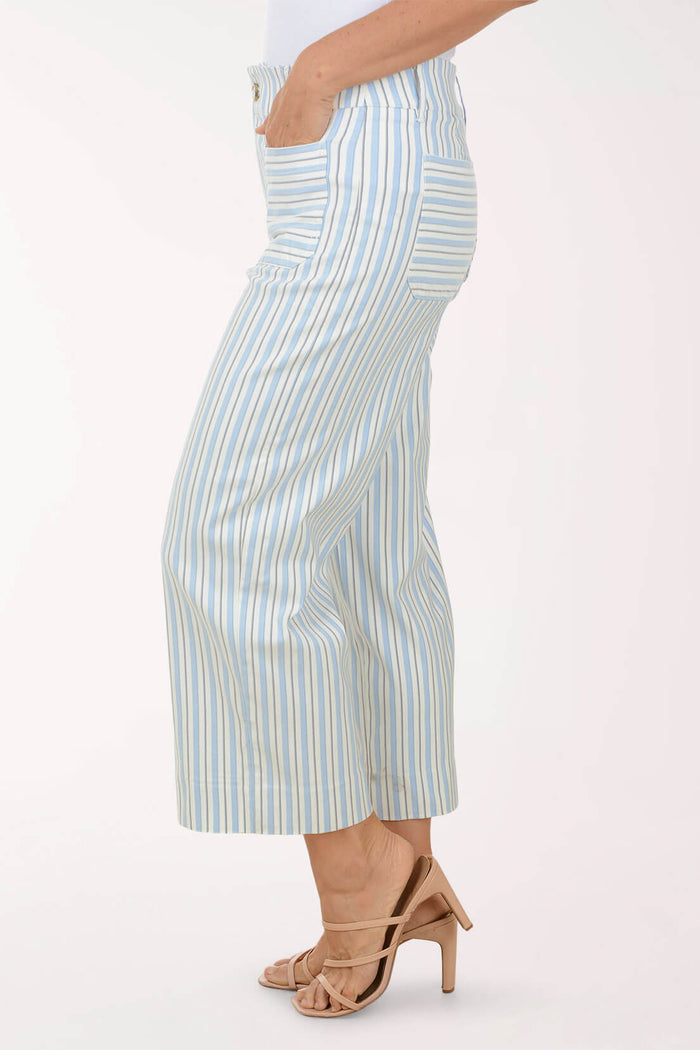 Person wearing light blue and white striped pants on a white background