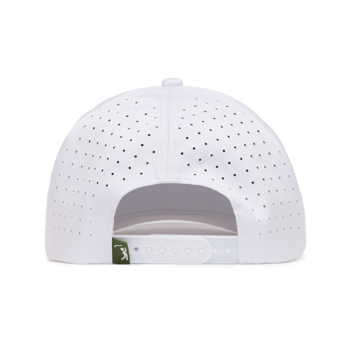 The image shows the back view of a white baseball cap with small ventilation holes. It features an adjustable snapback closure and a small green fabric tag on the left side with a white logo. The cap is set against a plain white background.