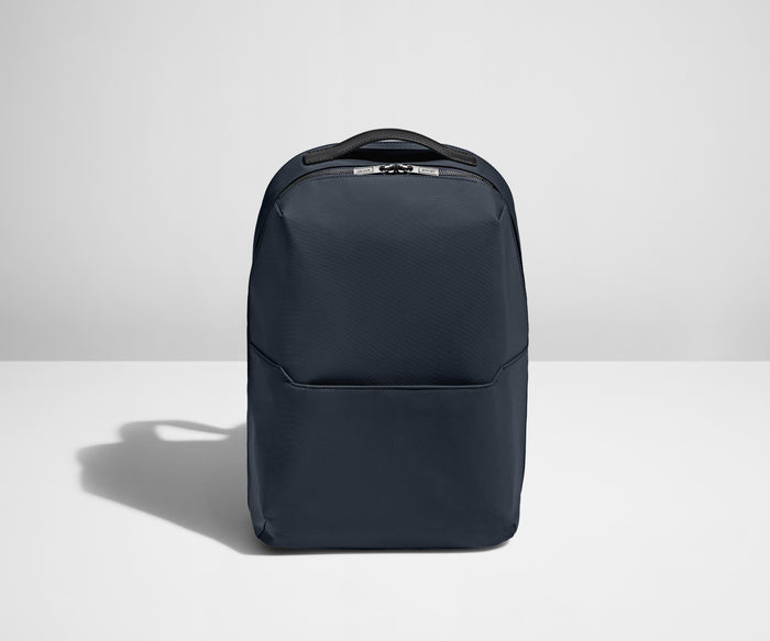 Backpack in Navy with one small pocket in the front.