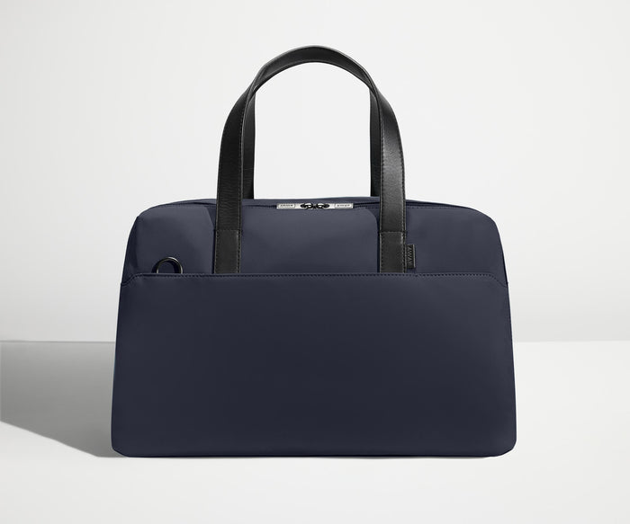Front view of The Overnight Bag with leather straps up