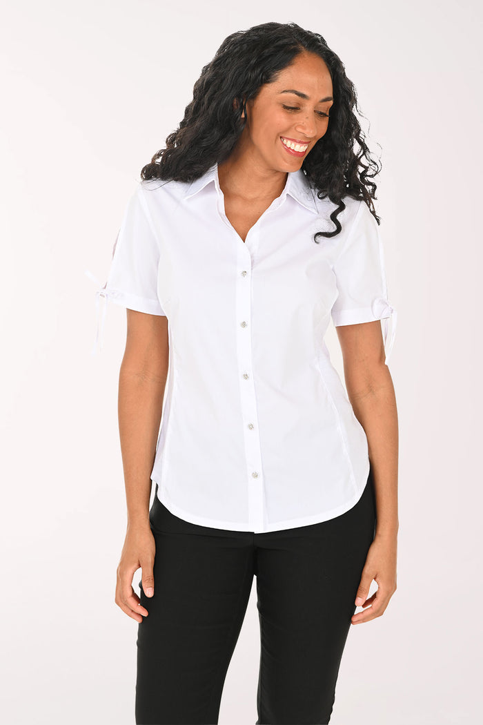 Woman wearing a white short-sleeve shirt and black pants on a white background