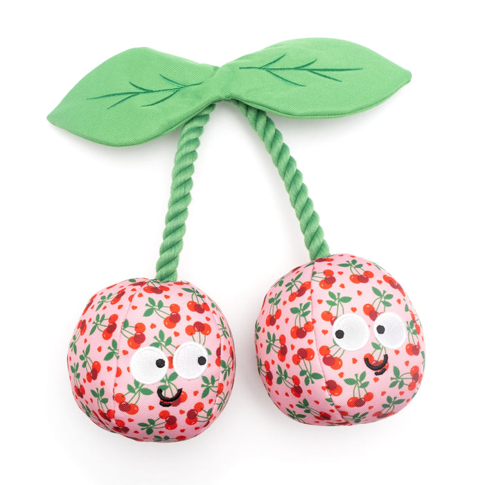 Plush toy resembling a cherry with a green stem on a white background