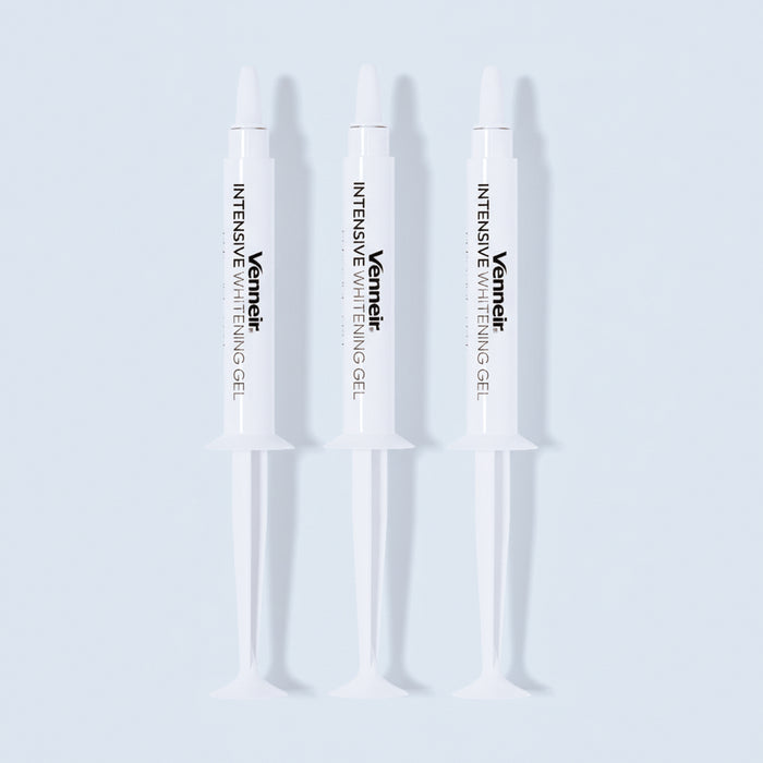 Three PAP whitening gel syringes for sensitive teeth on white background