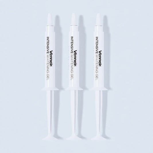 Three PAP whitening gel syringes for sensitive teeth on white background