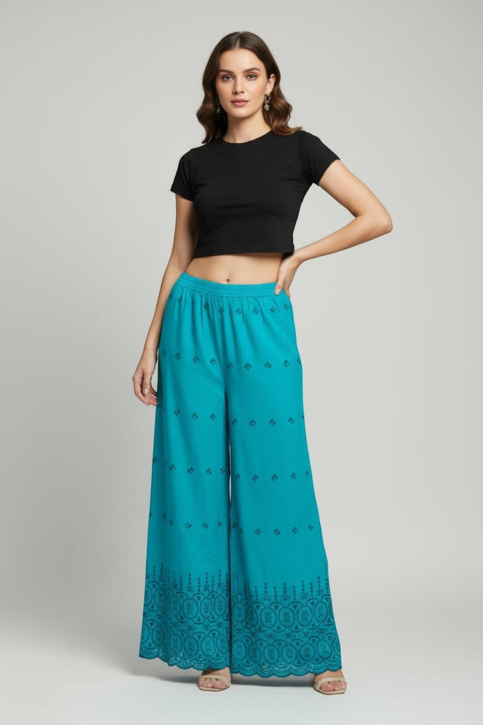 Kurti Connection USA teal wide-leg palazzo trousers with intricate embroidery and scalloped hem on a model