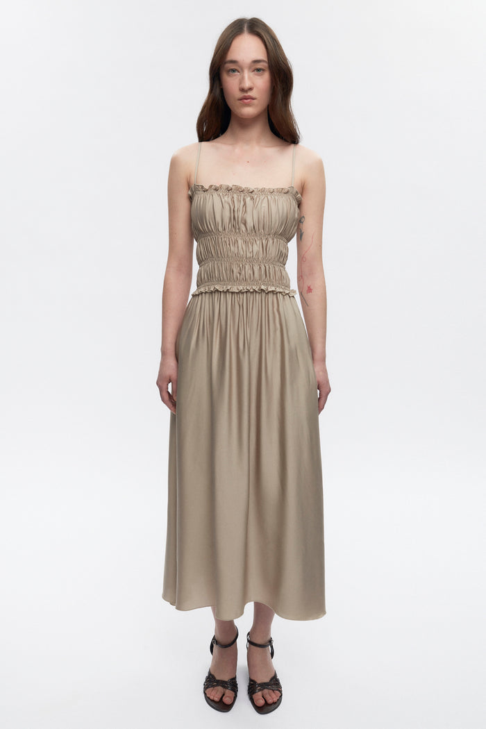 Elizabeth is 5’11" is a regular XS and is wearing an XS.
