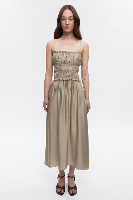 Elizabeth is 5’11" is a regular XS and is wearing an XS.