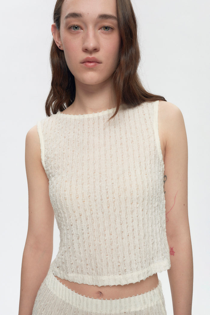 Elizabeth is 5’11" is a regular XS and is wearing an XS.